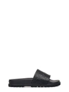 Gucci Gg Embossed Leather Slide Sandals In Black