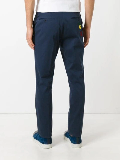 Shop Fendi Embroidered Face Tailored Trousers - Blue