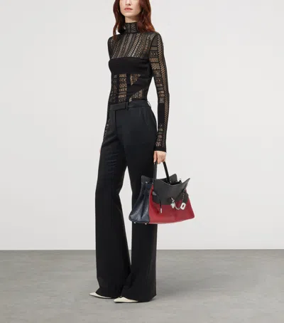 Alexander Mcqueen Mcqueen Wool Bootcut Trousers In Black