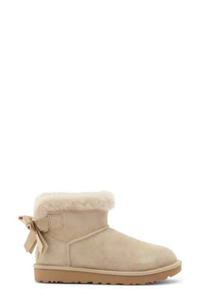Ugg ® Mini Bailey Bow Faux Shearling Boot In Mustard Seed
