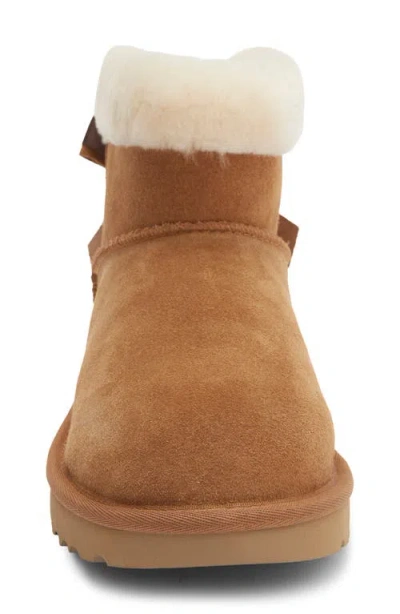 Ugg ® Mini Bailey Bow Faux Shearling Boot In Chestnut
