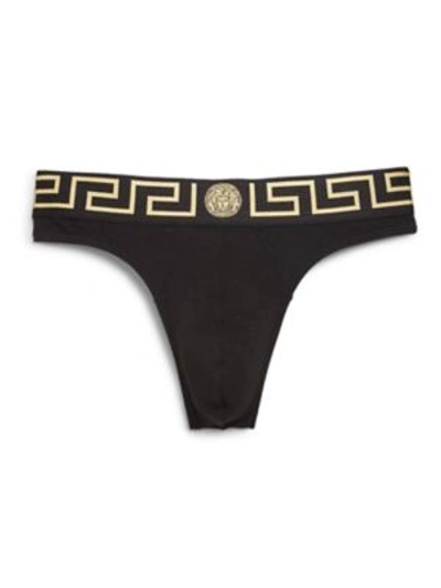 Shop Versace Iconic Logo Thong In Black