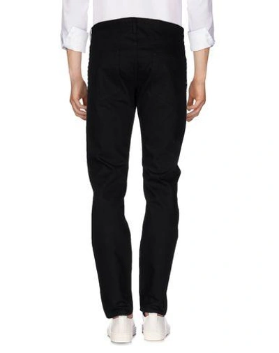 Shop Valentino Denim Pants In Black