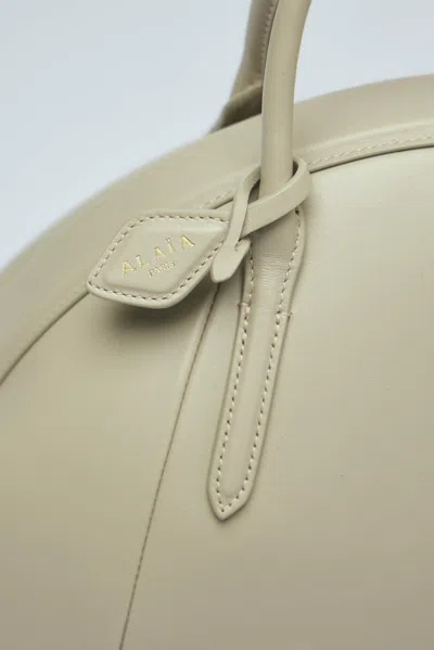 Alaïa Small Top Handle Purse In Beige