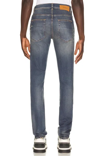 Amiri Distressed Patchwork Jeans In Blue