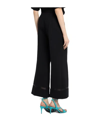 Khaite Wallace Flared Poly Pants In Red
