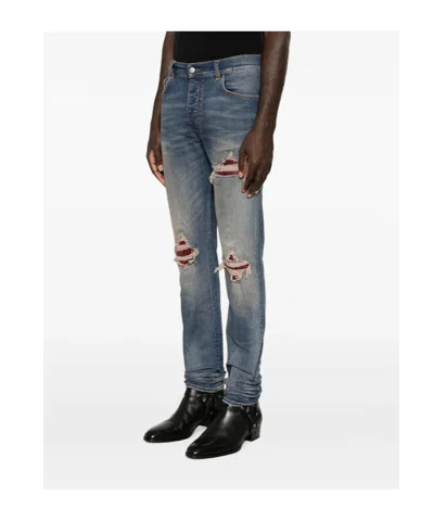 Amiri Distressed Patchwork Jeans In Blue