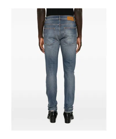 Amiri Distressed Patchwork Jeans In Blue