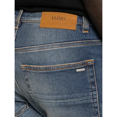 Amiri Distressed Patchwork Jeans In Blue