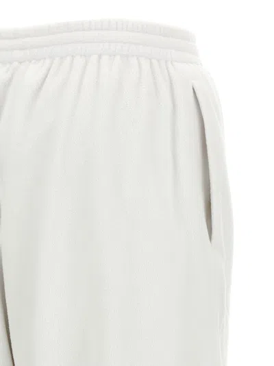 Balenciaga Cursive-embroidered Polyamide Joggers In White