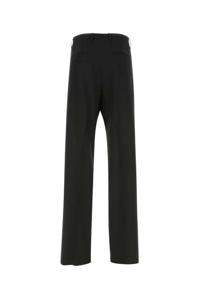 Versace Wool Elastane Trousers In Black