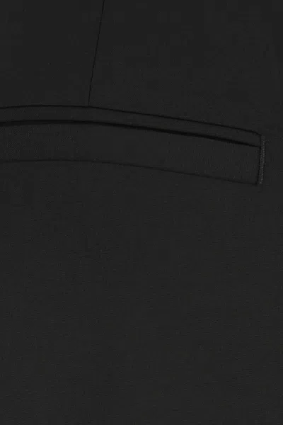 Versace Wool Elastane Trousers In Black