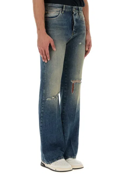 Amiri Slashed Boot Cut Jean In Blue