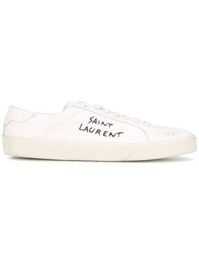 Shop Saint Laurent Logo Embossed Sneakers In Neutrals