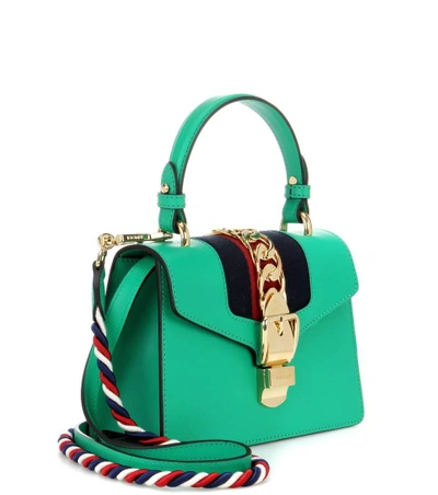 Shop Gucci Sylvie Mini Leather Crossbody Bag In Sye. G. Gar.