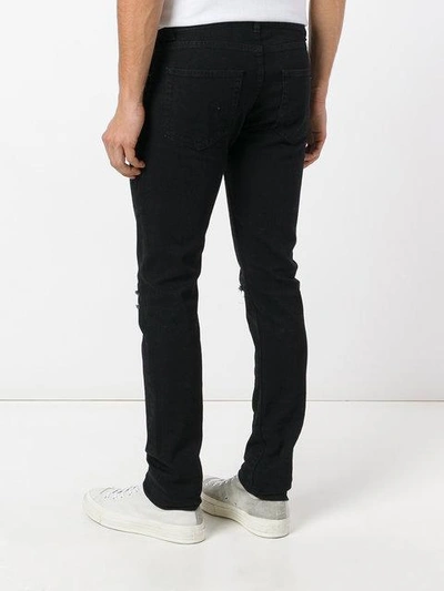 Shop Saint Laurent Low Waisted Skinny Jeans - Black