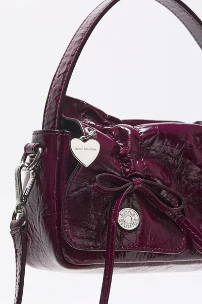 Acne Studios Multipocket Micro Bag In Berry Powder