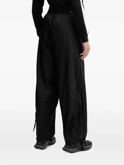 Puma Logo-print Drawstring Track Pants In Black