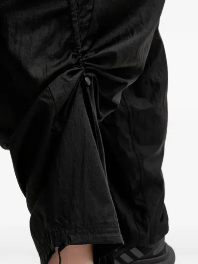 Puma Logo-print Drawstring Track Pants In Black