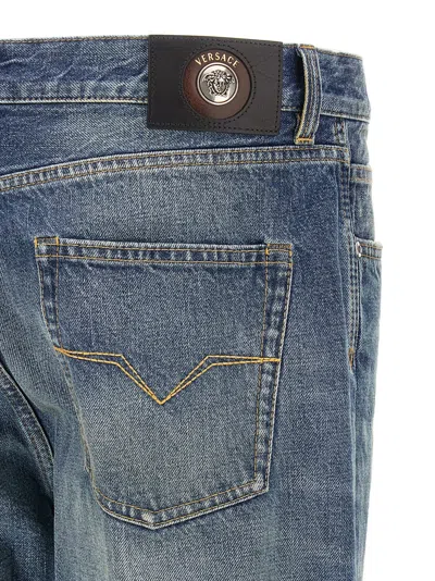 Versace Stone-washed Distressed Jeans In Blue