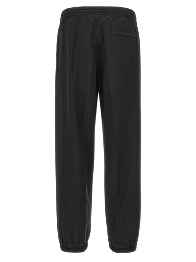 Givenchy Logo-embroidered Wool Joggers In Black
