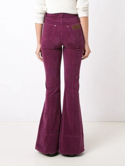 Shop Amapô High Waist Velvet Flared Trousers In Pink