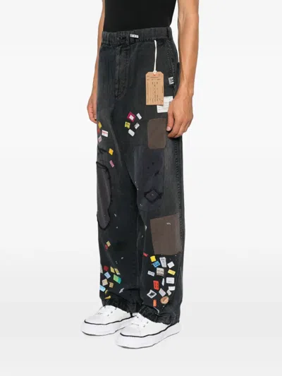 Miharayasuhiro Patchwork Ticket-print Jeans In Black