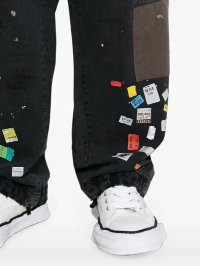 Miharayasuhiro Patchwork Ticket-print Jeans In Black