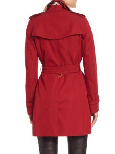 Shop Burberry Kensington Mid-length Heritage Trench Coat In Parade Red