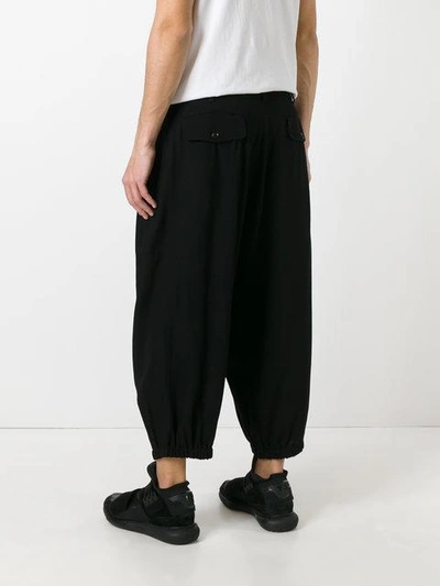 Shop Yohji Yamamoto Cropped Drop-crotch Trousers - Black