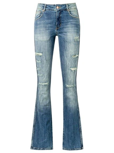 Shop Amapô Distressed Flared Jeans In Blue