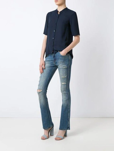 Shop Amapô Distressed Flared Jeans In Blue