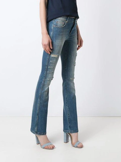 distressed flared jeans