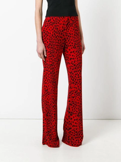 Shop Roberto Cavalli Printed Palazzo Pants In Red