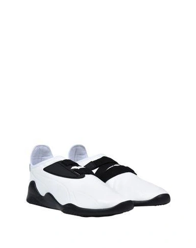 Shop Puma Sneakers In White