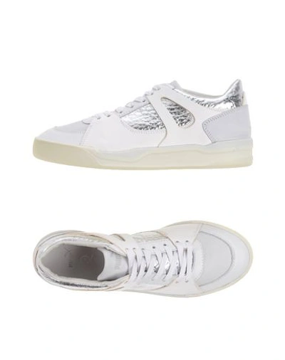 Shop Mcq Puma Sneakers In White