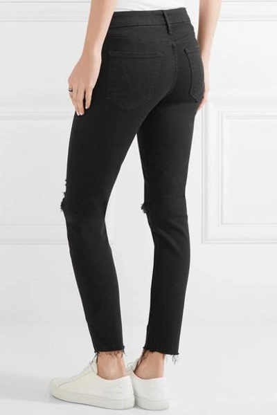 Shop Mother Looker Distressed Mid-rise Skinny Jeans In Black