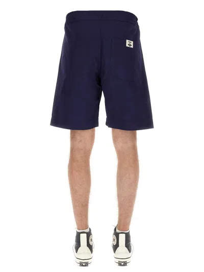 Umbro Logo Patch Bermuda Shorts In Blue