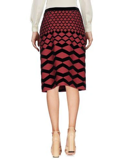 Shop Giulietta Knee Length Skirts In Brick Red