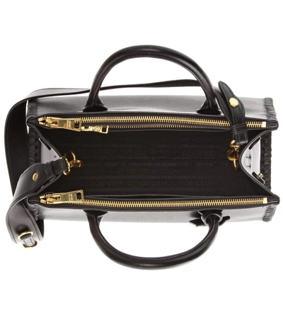 Shop Prada Paradigme Saffiano Leather Handbag In Eero
