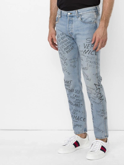 Gucci writing jeans sale