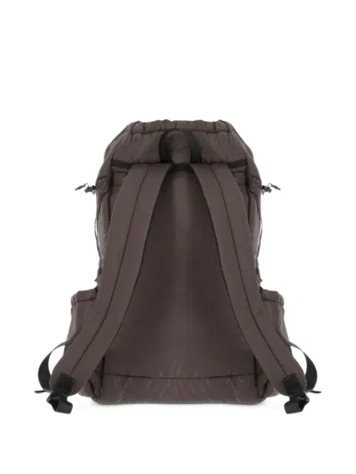 And Wander Diagonal-zip Drawstring Backpack In Brown