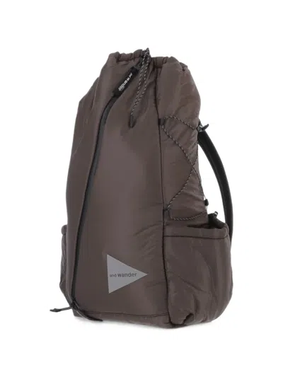 And Wander Diagonal-zip Drawstring Backpack In Brown