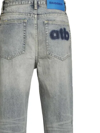 DISTRESSED PATCHWORK JEANS