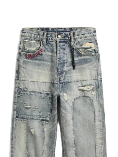 DISTRESSED PATCHWORK JEANS