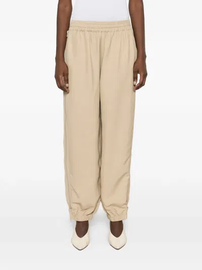 Co Side-zip Elasticated Trousers In Neutral