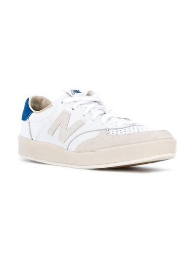 Shop New Balance 300 Leather Sneakers In White