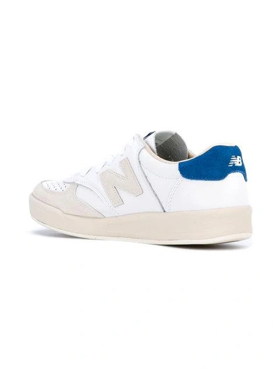 Shop New Balance 300 Leather Sneakers In White