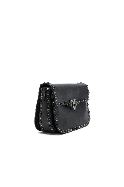 Shop Valentino Guitar Rockstud Rolling Shoulder Bag In Black