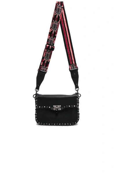 Shop Valentino Guitar Rockstud Rolling Shoulder Bag In Black